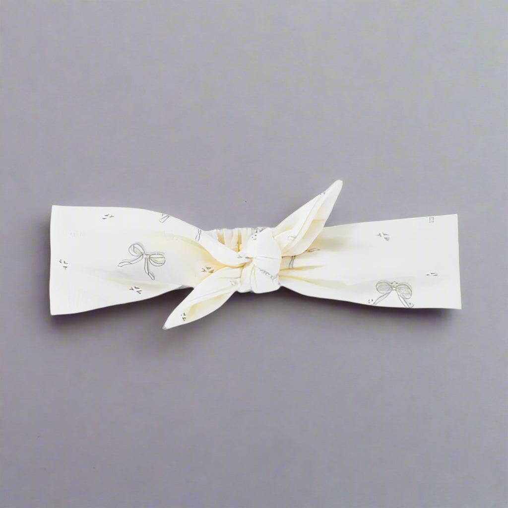 PRODUCT DESCRIPTION
Complete your little one's outfit with a matching headband. Gorgeous anytime and for any occasion. Easy to pull on and with a cute bow at the top in Milk White with Bows and Ribbon pattern. Match with Buttons and Bow Onesie. Not suitable for sleeping in.
MATERIALS
Elastic incased in 100% Organic Cotton
CARE INSTRUCTIONS
Please handwash in cold water and laundry powder suitable for your little one. Low fire risk. Keep away from heat and flame.