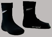 A pair of black merino wool socks with a white fern knitted in on each side, and the words 'NEW ZEALAND' embroidered on the sole.