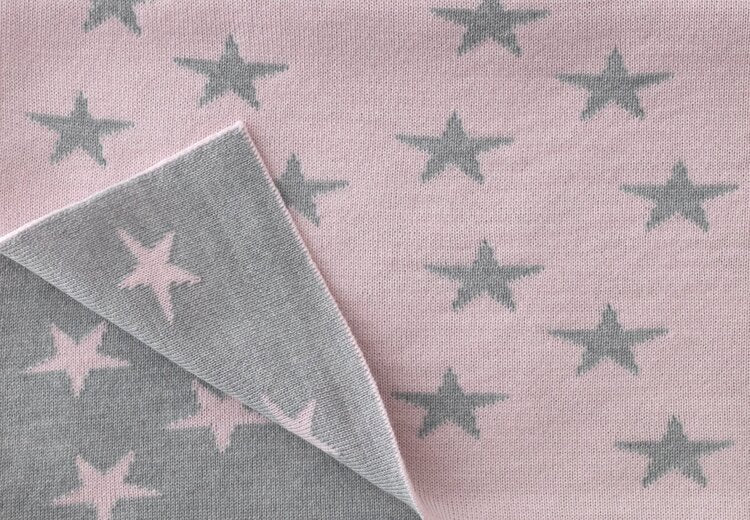 Cute little reversible star patterned blankets knitted in contrasting colours knitted by Country Laine. Proudly made in NZ.
