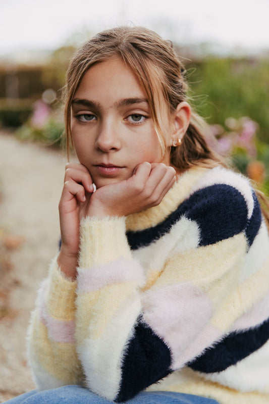 A classic crew neck jumper in a gorgeous combination of stripes in white, pale blush pink and navy. Knitted using a brushed yarn this relaxed style jumper is so soft and cuddly it will be a favourite for the cooler months. By Eve Girl in sizes 3-7yrs.