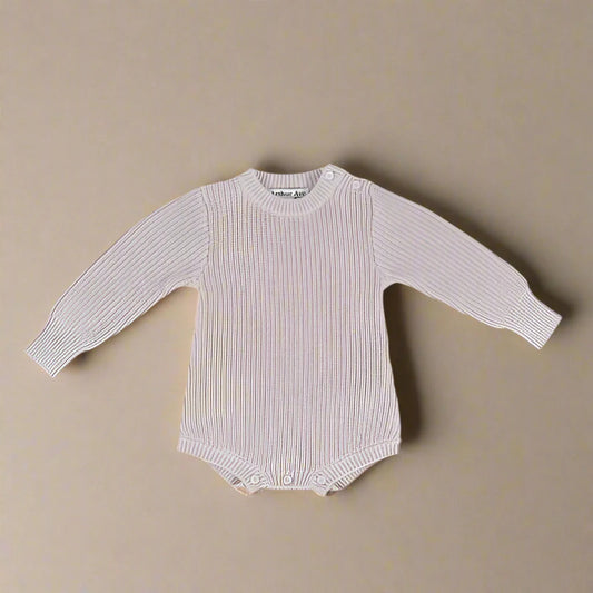 The Beige Cotton Playsuit featuring shoulder-opening buttons is beautifully designed and made, with extended cuffs to get long lasting wear. Ideal for the cooler days it is the perfect outfit for any special occasion, flower girl dress, christening or wedding, match it with the Furry Ear Beanie available in Beige or Soft Pink.
MATERIALS. 100% Cotton
CARE AND SAFETY INSTRUCTIONS
Please read all product labels. Not recommended for sleepwear. Low Fire Hazard. Keep away from heat and flame.